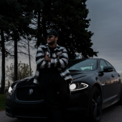 Picture of a person with his car